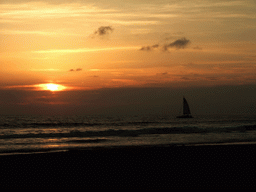 Beach and sailboat at the Ocean Front Walk, at sunset
