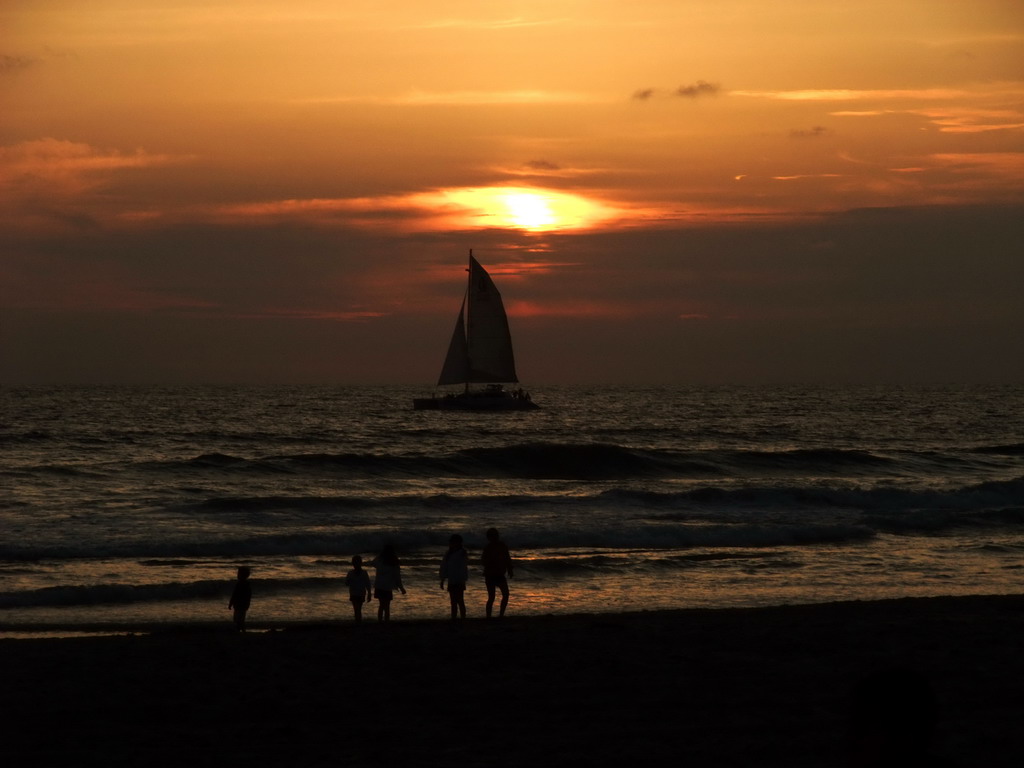 Beach and sailboat at the Ocean Front Walk, at sunset