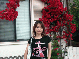 Miaomiao with flowers at Mission Boulevard