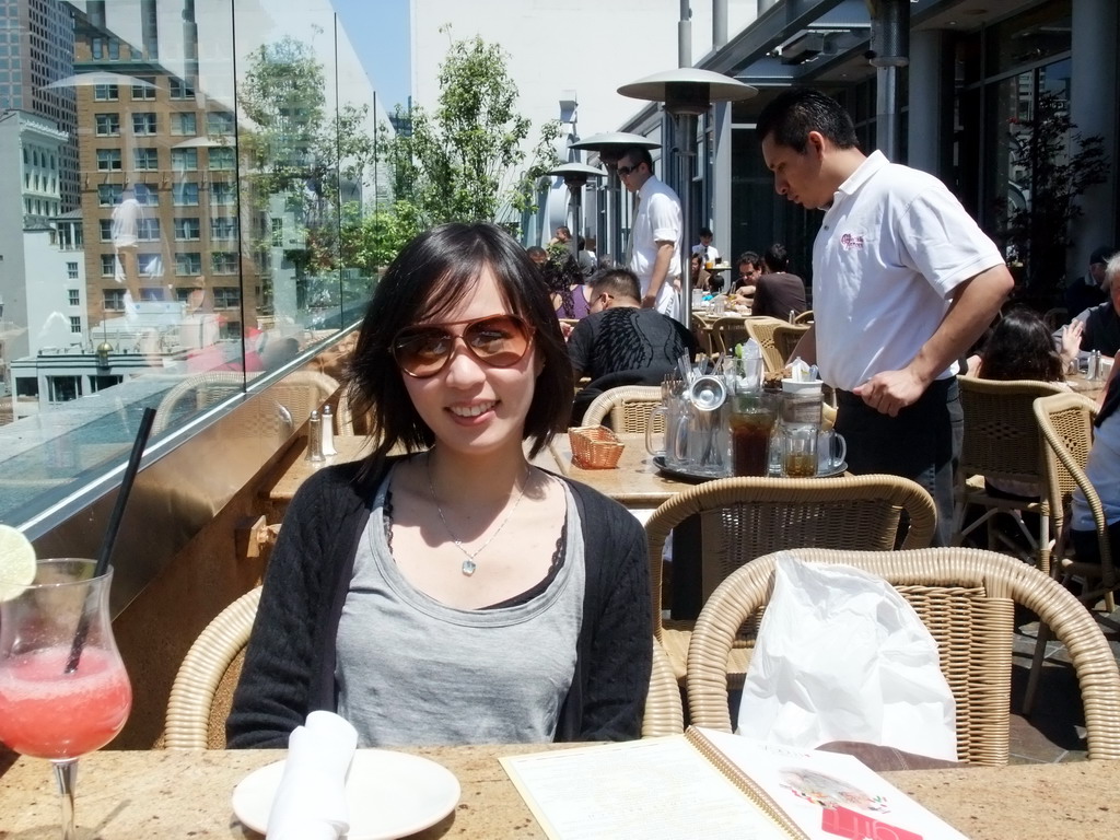 Mengjin having a drink at the Cheesecake Factory restaurant at Macy`s department store