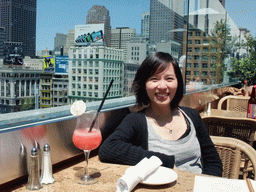 Mengjin having a drink at the Cheesecake Factory restaurant at Macy`s department store