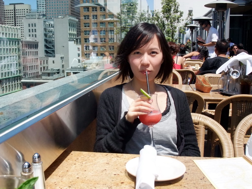 Mengjin having a drink at the Cheesecake Factory restaurant at Macy`s department store