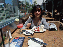 Mengjin having cake with strawberry and cream, at the Cheesecake Factory restaurant at Macy`s department store