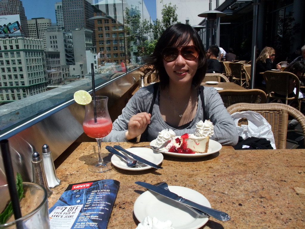 Mengjin having cake with strawberry and cream, at the Cheesecake Factory restaurant at Macy`s department store