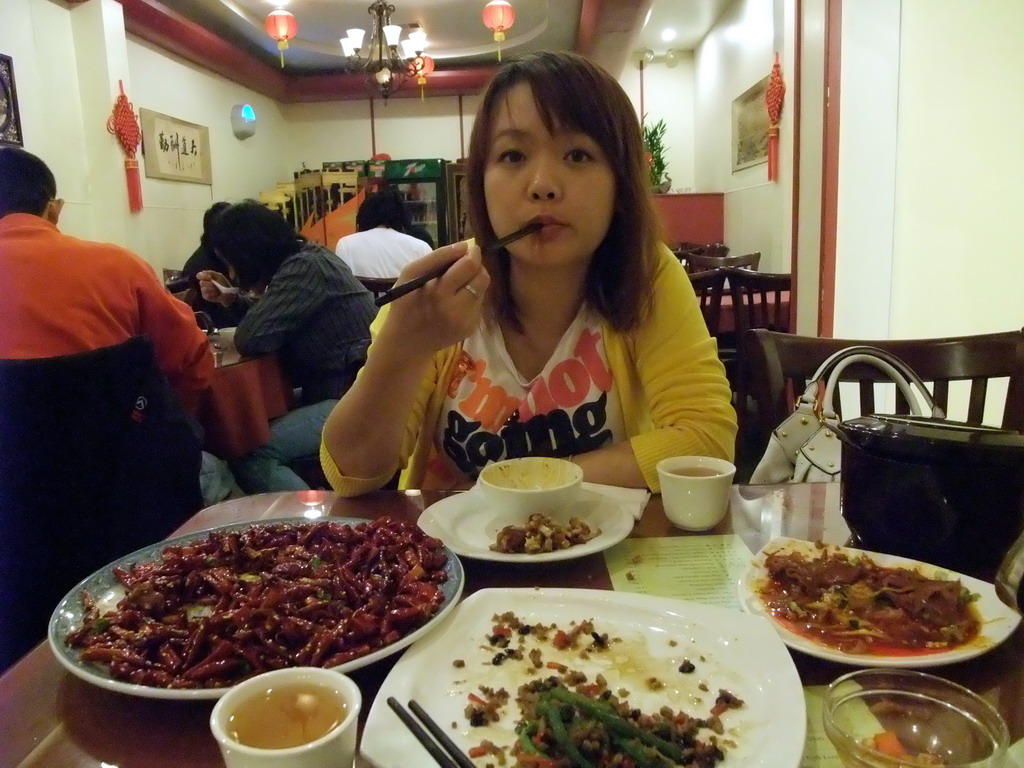 Miaomiao having dinner in a Chinese restaurant