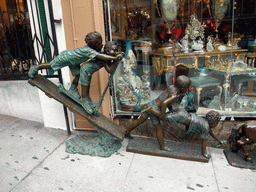 Sculptures of children in a shopping street