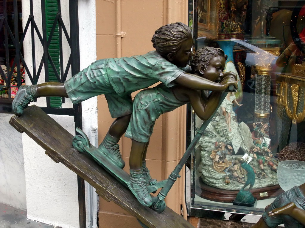 Sculptures of children in a shopping street