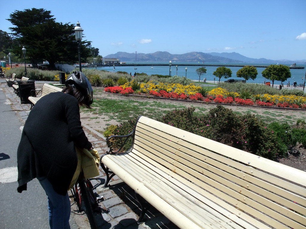 Mengjin with bike at the beach and pier of the Aquatic Park Historic District
