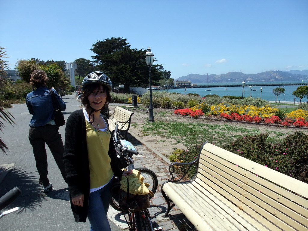 Mengjin with bike at the beach and pier of the Aquatic Park Historic District