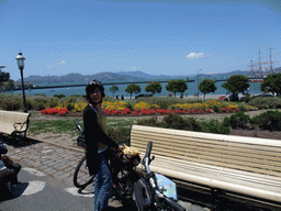 Mengjin with bike at the beach and pier of the Aquatic Park Historic District