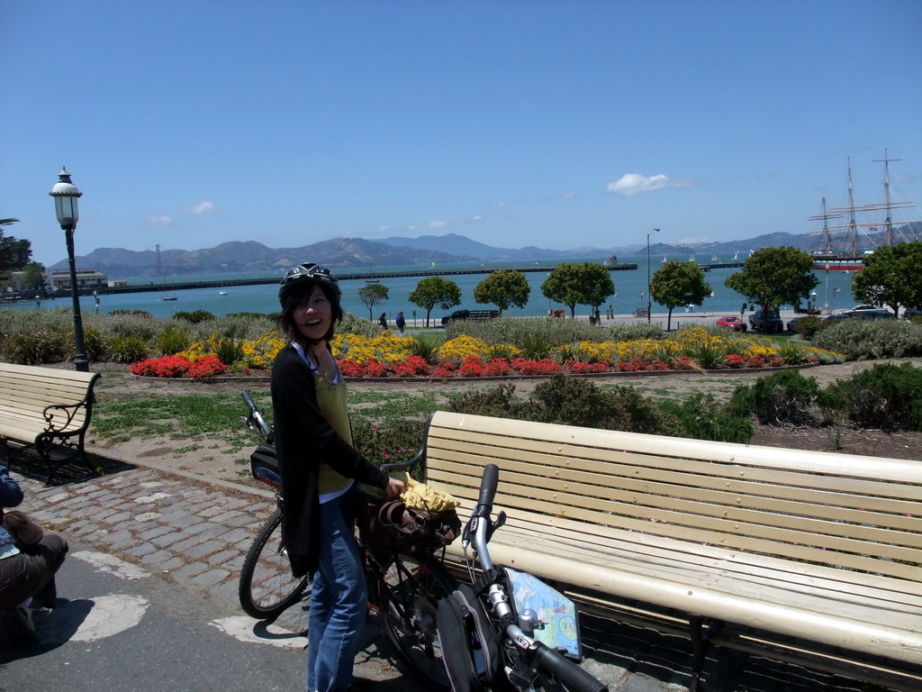 Mengjin with bike at the beach and pier of the Aquatic Park Historic District