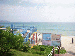 The beach of Yalong Bay with the beach shack of Gloria Resort Sanya