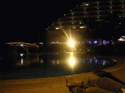 Miaomiao at the swimming pool at the Gloria Resort Sanya, by night