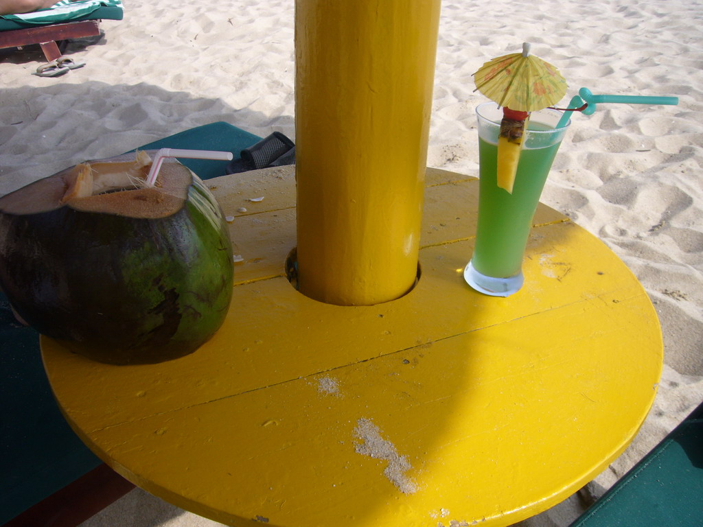 Coconut and cocktail at the private beach of Gloria Resort Sanya