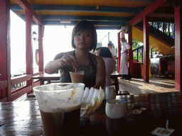 Miaomiao having a drink at the beach shack of Gloria Resort Sanya