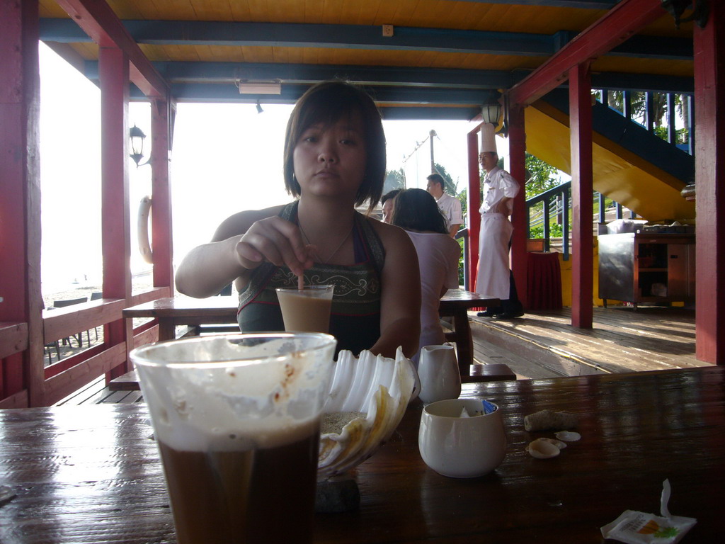Miaomiao having a drink at the beach shack of Gloria Resort Sanya