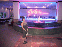 Miaomiao at a fountain in the lobby of the Gloria Resort Sanya