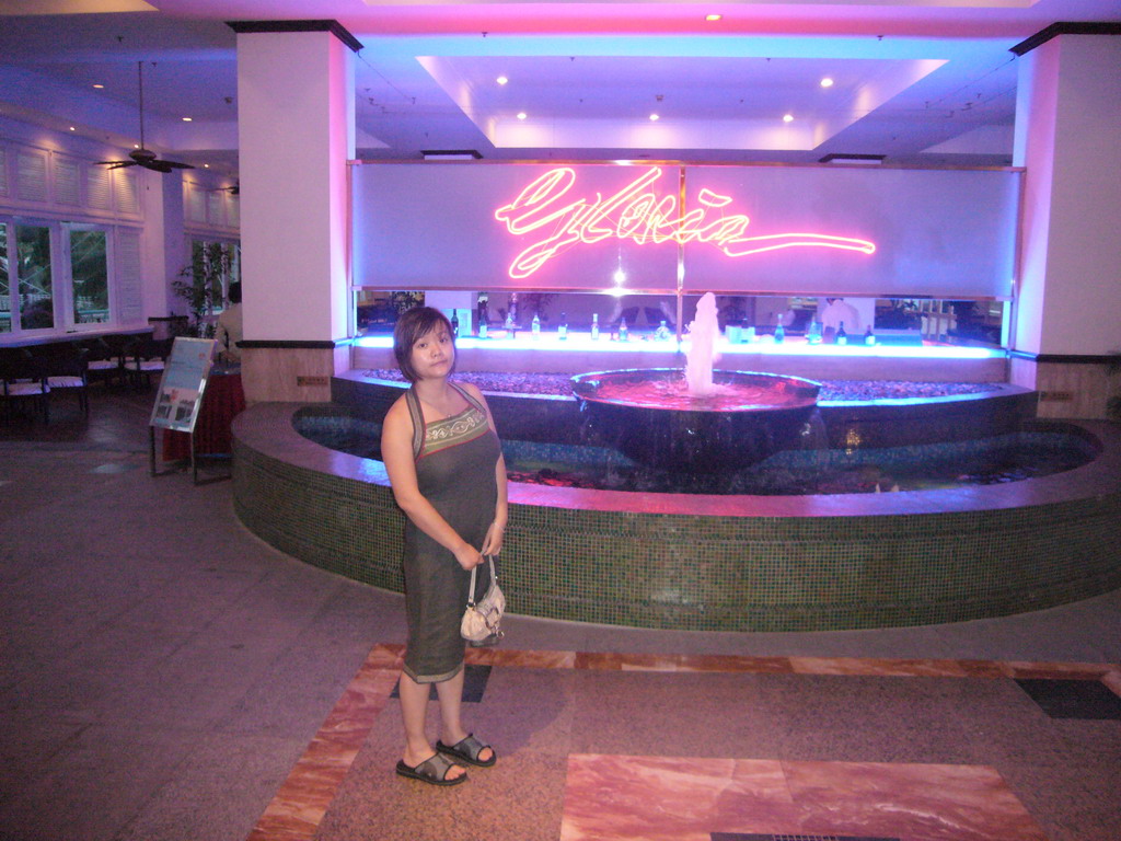 Miaomiao at a fountain in the lobby of the Gloria Resort Sanya