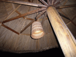 Umbrella with a lamp at the beach of Yalong Bay, by night