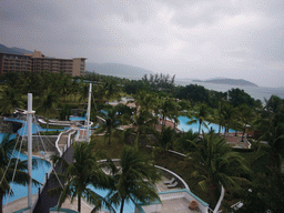 The gardens and swimming pool of the Gloria Resort Sanya and Yalong Bay, viewed from above