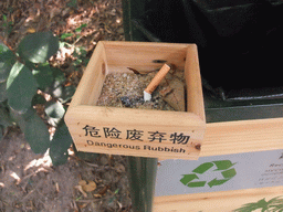 Ashtray with chinglish text at the Sanya Nanshan Dongtian Park