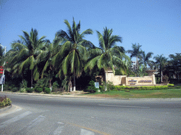 Palm trees in front of the Howard Johnson Resort Sanya, viewed from a car