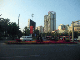 Flowers and apartment buildings in the Yuechuan district, viewed from a car