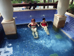 Miaomiao and Mengjin with little fish in the Dr. Fish pool at the Fisherman`s Wharf at the Ocean Sonic Resort