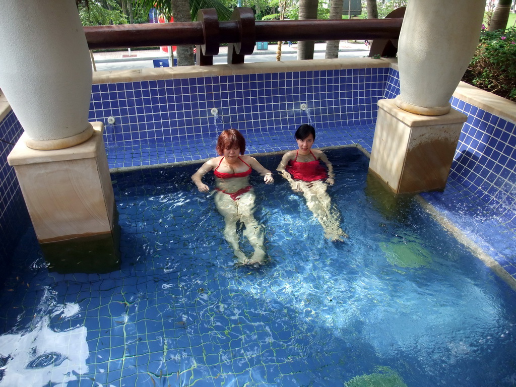 Miaomiao and Mengjin with little fish in the Dr. Fish pool at the Fisherman`s Wharf at the Ocean Sonic Resort