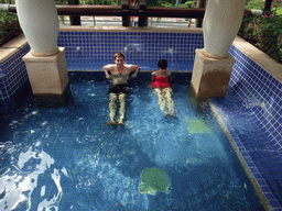 Tim and Mengjin with little fish in the Dr. Fish pool at the Fisherman`s Wharf at the Ocean Sonic Resort
