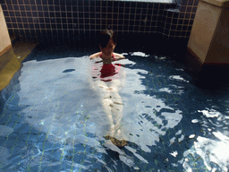 Mengjin with little fish in the Dr. Fish pool at the Fisherman`s Wharf at the Ocean Sonic Resort