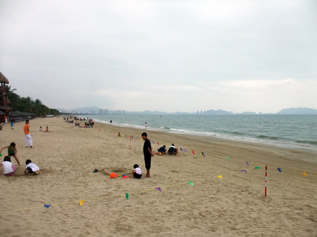 The beach in front of the Ocean Sonic Resort, and the skyline of Sanya