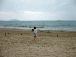 Miaomiao at the beach in front of the Ocean Sonic Resort