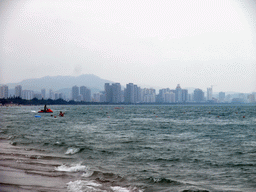 The beach in front of the Ocean Sonic Resort, and the skyline of Sanya