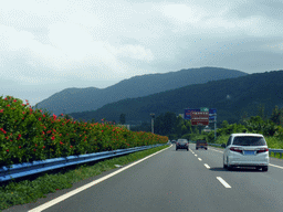 Mountains and the G98 Hainan Ring Road Expressway near the Xinglong Tropical Botanical Garden, viewed from the car
