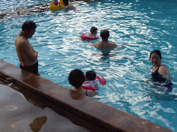Miaomiao, Max and Miaomiao`s family in the swimming pool of the Sanya Bay Mangrove Tree Resort