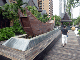 Miaomiao with a boat and a pavilion at the central area of the Sanya Bay Mangrove Tree Resort