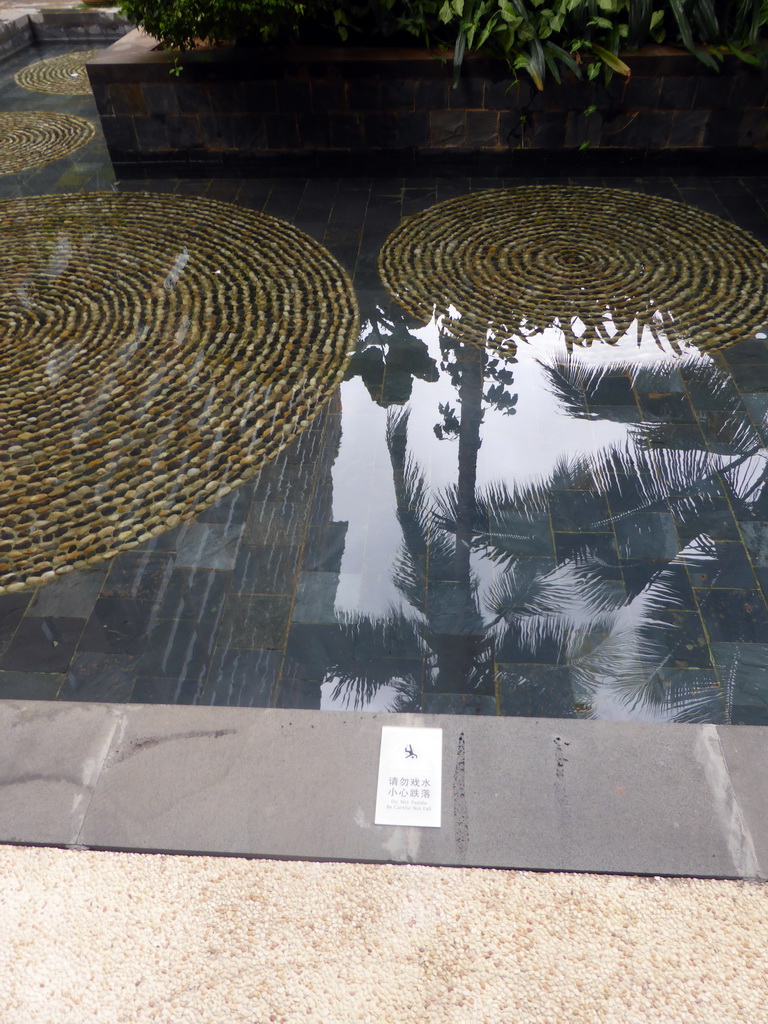 Pond with Chinglish sign at the central area of the Sanya Bay Mangrove Tree Resort