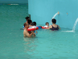 Miaomiao, Max and Miaomiao`s family at the swimming pool of the Amazon Jungle Water Park at the central area of the Sanya Bay Mangrove Tree Resort