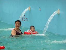 Miaomiao and Max at the swimming pool of the Amazon Jungle Water Park at the central area of the Sanya Bay Mangrove Tree Resort