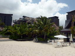 Beach with chairs at the Amazon Jungle Water Park at the central area of the Sanya Bay Mangrove Tree Resort