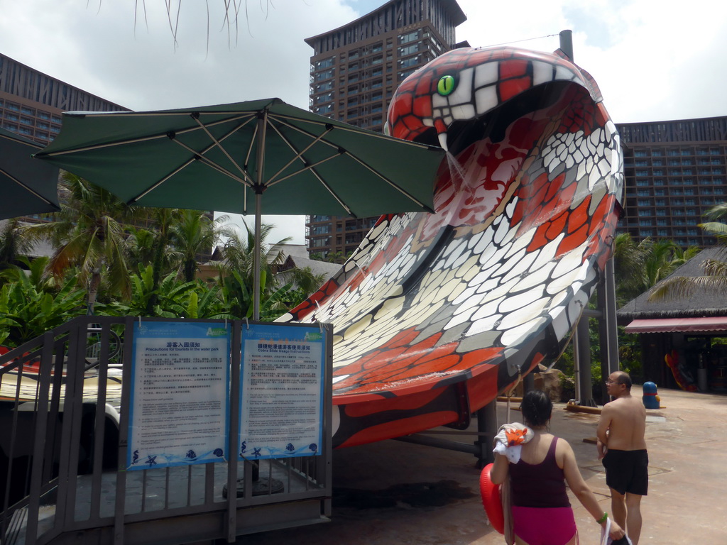 Miaomiao and her family in front of the Cobra Slide at the Amazon Jungle Water Park at the central area of the Sanya Bay Mangrove Tree Resort