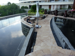 Miaomiao and Max at the pond in the lobby of the InterContinental Sanya Haitang Bay Resort