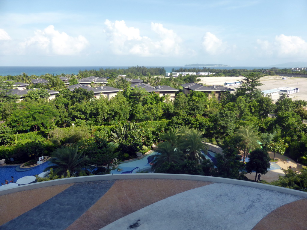 The swimming pool of the InterContinental Sanya Haitang Bay Resort, Haitang Bay and the Wuzhizhou island, viewed from the balcony of our room