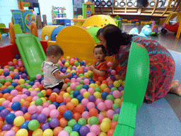 Max playing with another kid in the ball pit in the Play Room of the InterContinental Sanya Haitang Bay Resort