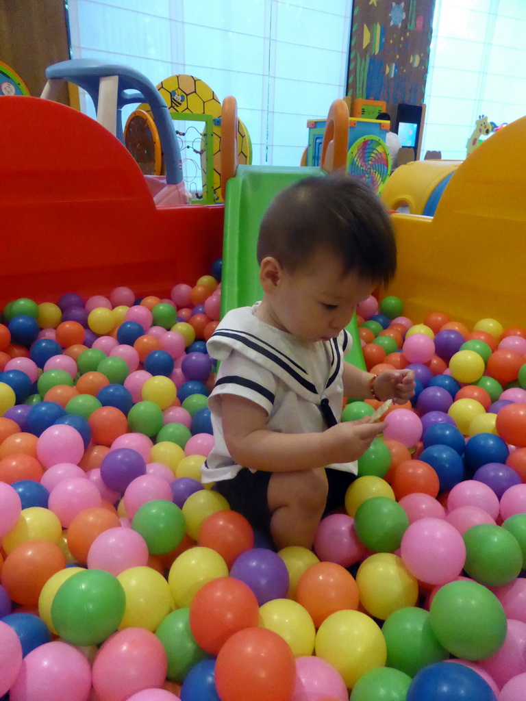 Max playing in the ball pit in the Play Room of the InterContinental Sanya Haitang Bay Resort