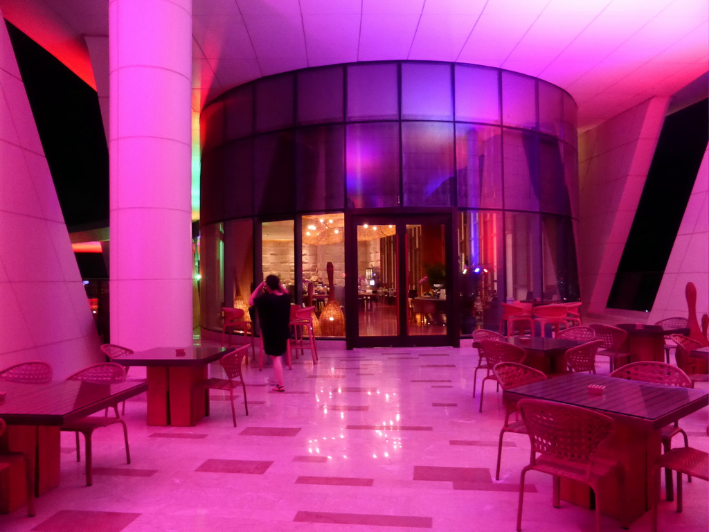 Miaomiao at the bar at the top floor of the InterContinental Sanya Haitang Bay Resort, by night