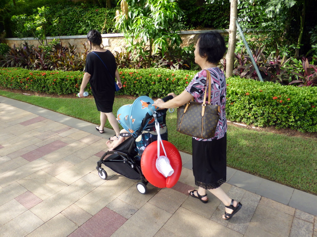 Miaomiao, Max and Miaomiao`s mother in the garden of the InterContinental Sanya Haitang Bay Resort