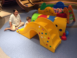 Miaomiao and Max playing on the slide in the Play Room of the InterContinental Sanya Haitang Bay Resort