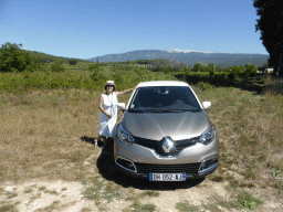 Miaomiao with our rental car and a view on the Mont Ventoux mountain, along the D942 road from Avignon